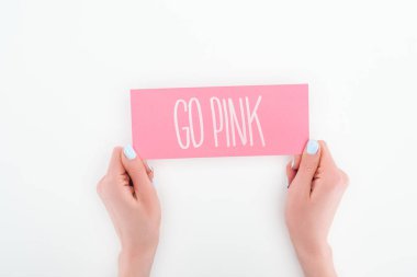 partial view of woman holding pink card with go pink lettering on white background clipart