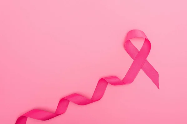 Top View Curved Crimson Breast Cancer Sign Pink Background — Stock Photo, Image