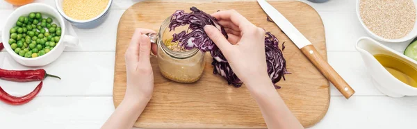 Cropped View Woman Adding Cut Red Cabbage Jar Salad Wooden — Stock Photo, Image