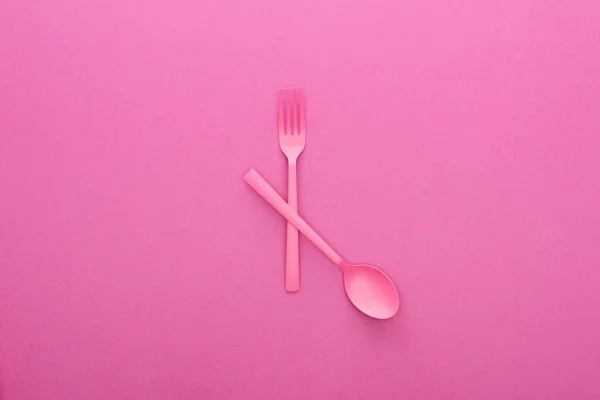 Crossed Pink Plastic Fork Spoon Isolated Pink — Stock Photo, Image