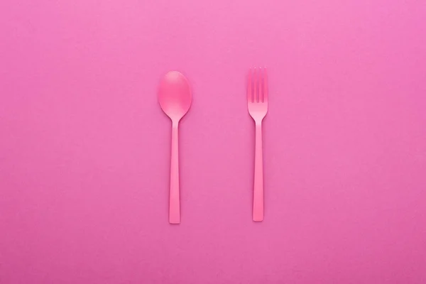 Pink plastic spoon and fork isolated on pink — Stock Image Pink Plastic Spoon Fork Isolated Pink Stock Photo