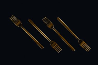 four metal forks isolated on black clipart