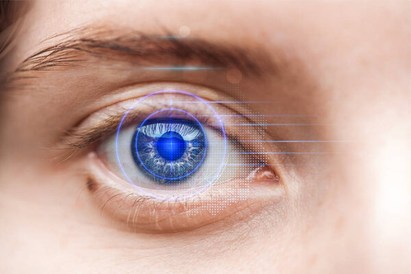 close up view of woman grey eye with data illustration, robotic concept
