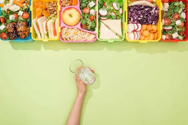 Cropped View Woman Holding Glass Water Hand Lunch Boxes Food — Stock Photo, Image