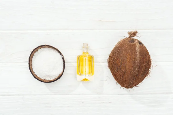 Flat Lay Coconut Oil Bottle Whole Coconut Half White Wooden — Stock Photo, Image