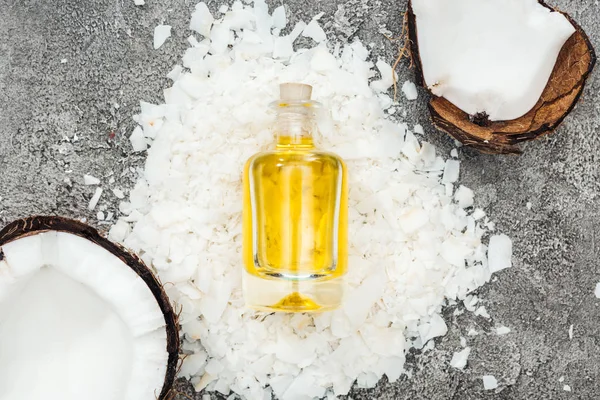 Top View Coconut Oil Bottle Grey Textured Background Coconut Shavings — Stock Photo, Image