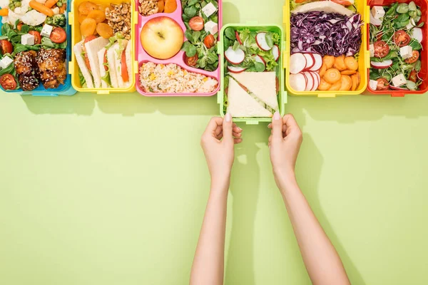 Cropped view of woman choosing lunch boxes with food — Stock Image Cropped View Woman Choosing Lunch Boxes Food Stock Picture