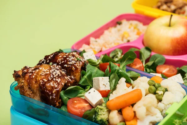 Close up view of meal in lunch boxes isolated on green — Stock Image Close View Meal Lunch Boxes Isolated Green Stock Image