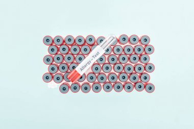 top view of empty test tube with allergy test lettering isolated on blue clipart