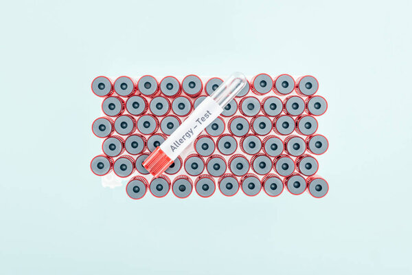 top view of empty test tube with allergy test lettering isolated on blue