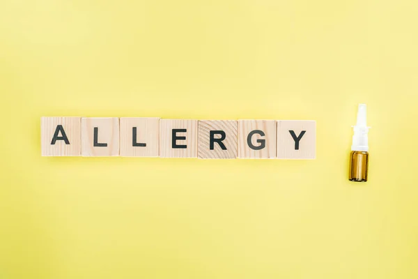 Top View Wooden Blocks Allergy Lettering Nasal Spray Isolated Yellow — Stock Photo, Image