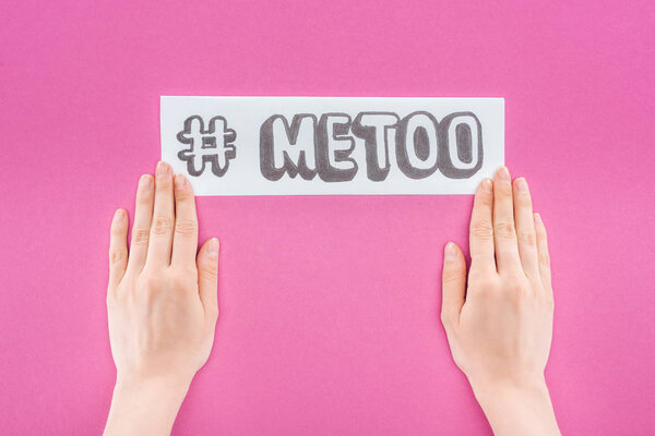 cropped view of woman holding paper with hashtag me too isolated on pink