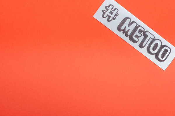 top view of paper with hashtag me too isolated on orange
