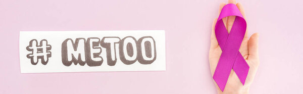 panoramic shot of purple awareness ribbon on hand of woman near paper with hashtag me too isolated on pink