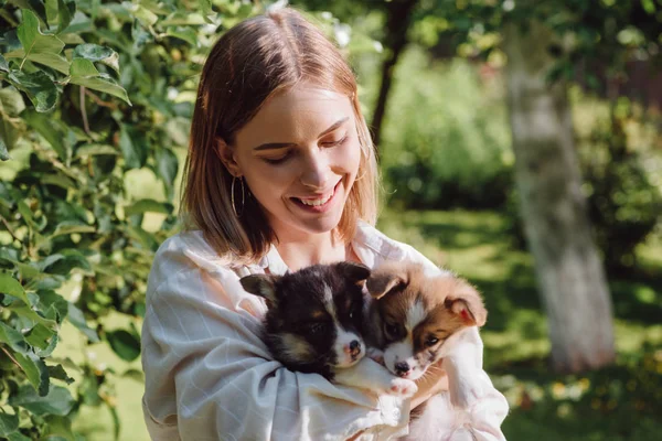 Happy Blonde Girl Holding Cute Welsh Corgi Puppies Garden Green — Stock Photo, Image