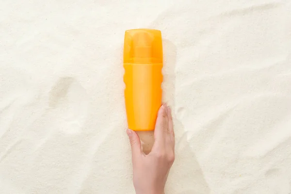 Cropped View Woman Holding Orange Sunscreen Lotion Golden Sand — Stock Photo, Image