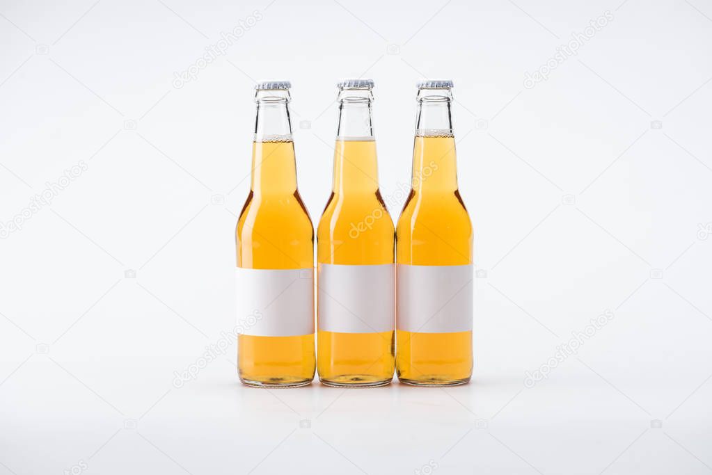 bottles of beer with white blank labels on white background