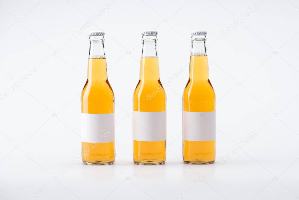 bottles of beer with blank labels on white background