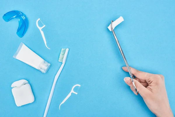 Cropped View Woman Holding Tweezers Cotton Pad Toothpaste Toothbrush Blue — Stock Photo, Image