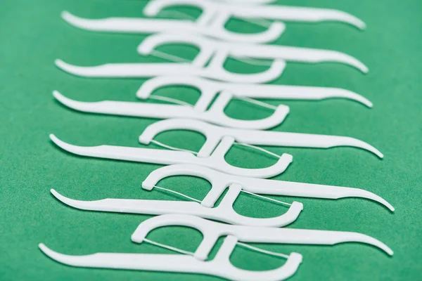 Selective Focus White Floss Toothpicks Isolated Green — Stock Photo, Image