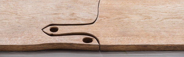panoramic shot of wooden and brown chopping boards with copy space 
