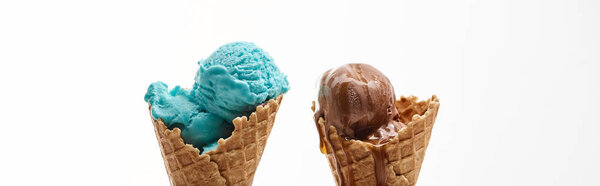 delicious sweet chocolate and blue ice cream in crispy waffle cones isolated on white, panoramic shot
