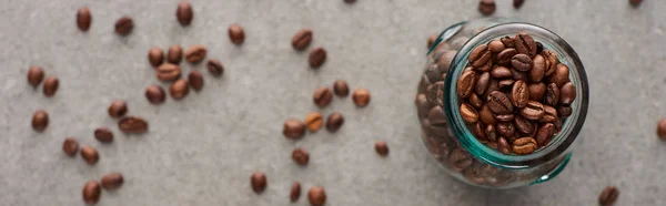 Selective Focus Coffee Grains Glass Jar Grey Background Panoramic Shot — Stock Photo, Image