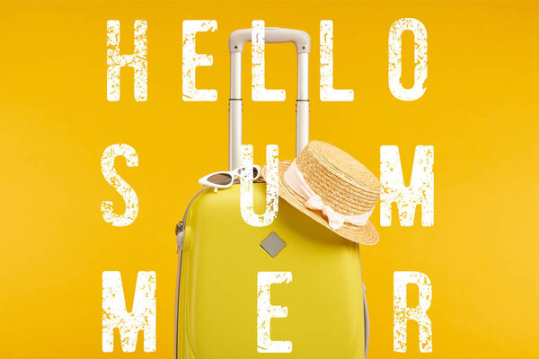 yellow colorful travel bag with sunglasses and straw hat isolated on yellow with hello summer illustration