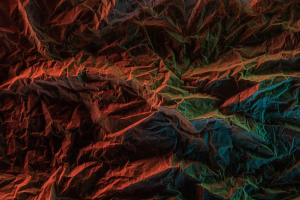 Ylhäältä Näkymä Rypistynyt Paperi Värikäs Valaistus Pimeässä — kuvapankkivalokuva