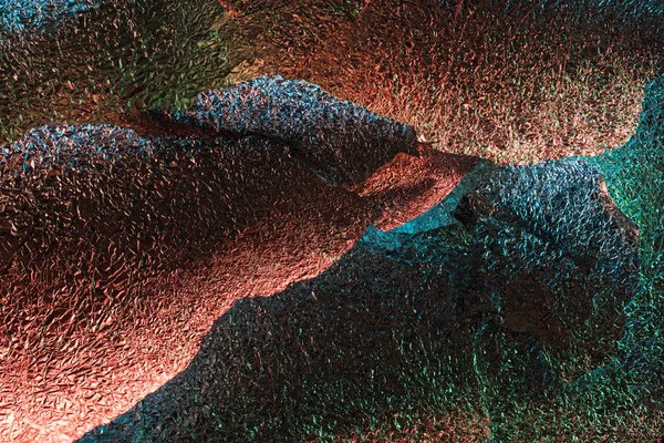 Abstrakter Hintergrund Aus Glänzend Strukturierter Lumpenfolie Mit Farbenfroher Beleuchtung — Stockfoto
