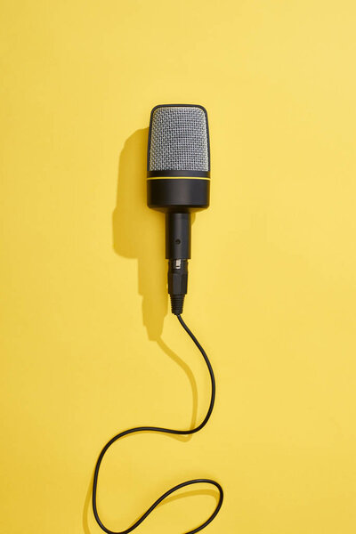 top view of microphone on bright and colorful background 