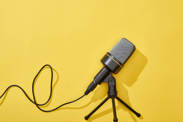 top view of microphone on bright and colorful background 