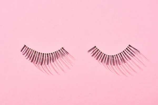 Top View False Eyelashes Pink Background Copy Space — Stock Photo, Image