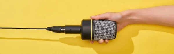 Panoramic Shot Woman Holding Microphone Yellow Background — Stock Photo, Image