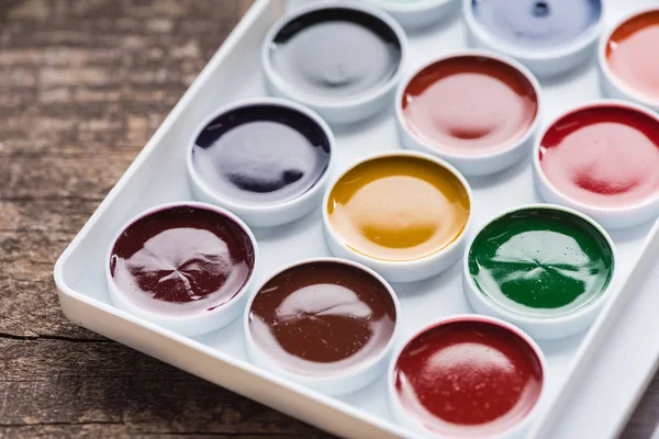 stock image close up view of watercolor new colorful paint palette