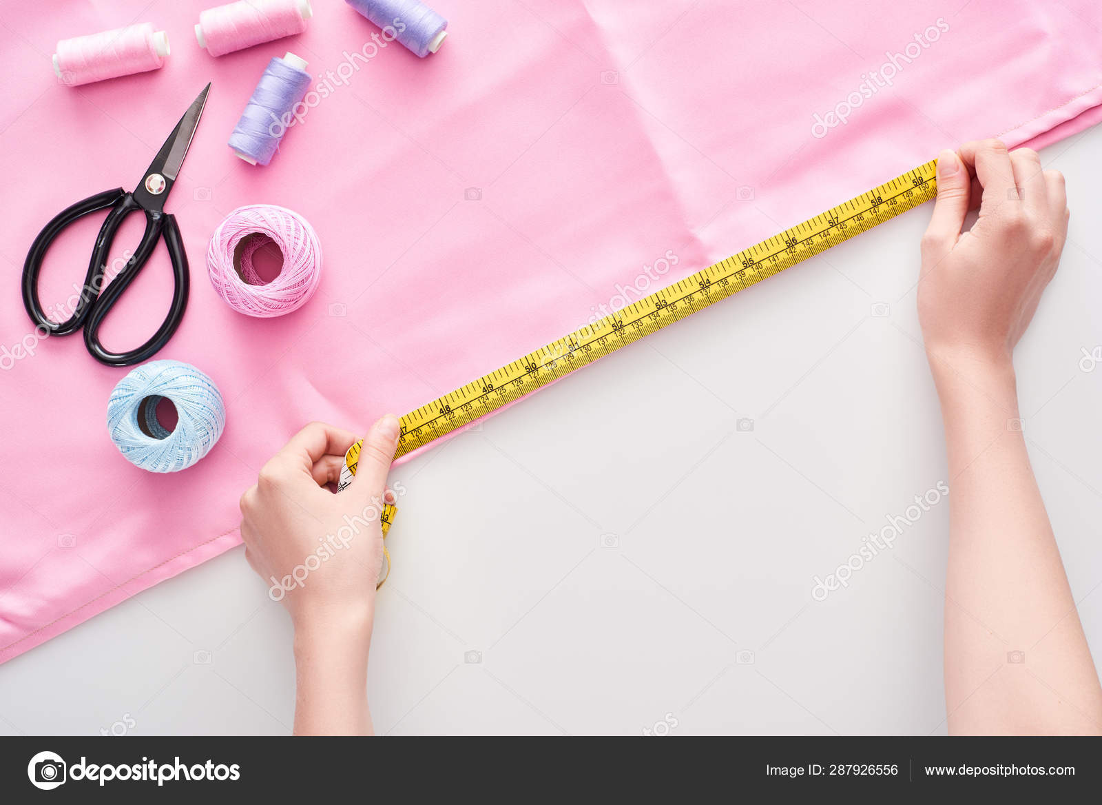 https://st4.depositphotos.com/13324256/28792/i/1600/depositphotos_287926556-stock-photo-cropped-view-seamstress-measuring-fabric.jpg