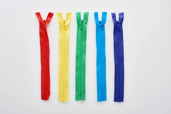 Top View Bright Colorful Zippers White Background — Stock Photo, Image