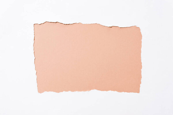 beige colorful background in white torn paper hole