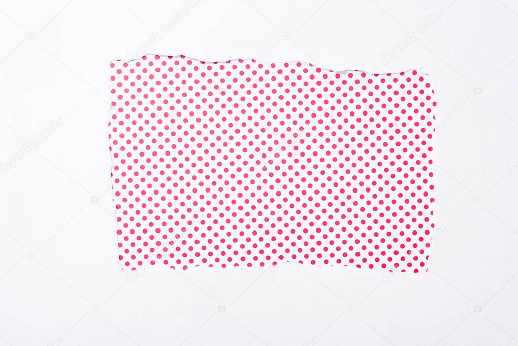 polka dot pink and white colorful background in white torn paper hole