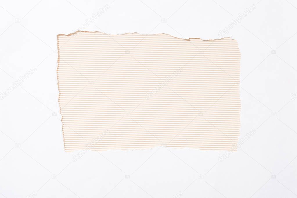 beige striped colorful background in white torn paper hole