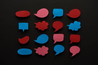 top view of empty speech bubbles on black background, cyberbullying concept clipart