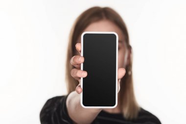 selective focus of victim of cyberbullying showing smartphone with blank screen isolated on white clipart