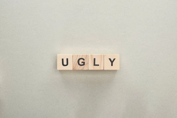 Top View Wooden Blocks Ugly Lettering Grey Background Bullying Concept — Stock Photo, Image