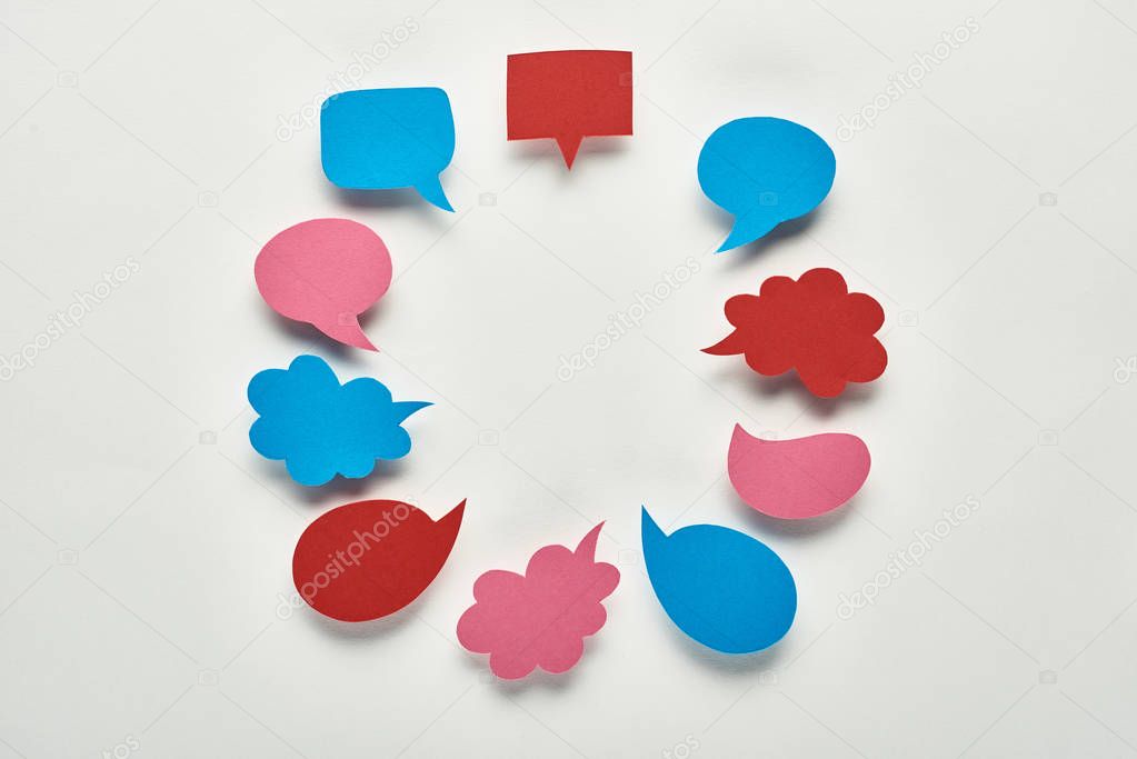 round frame of empty speech bubbles on white background, cyberbullying concept