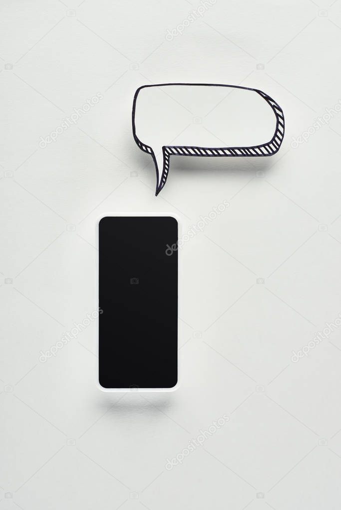 top view of smartphone with blank screen on white background with empty speech bubble, cyberbullying concept