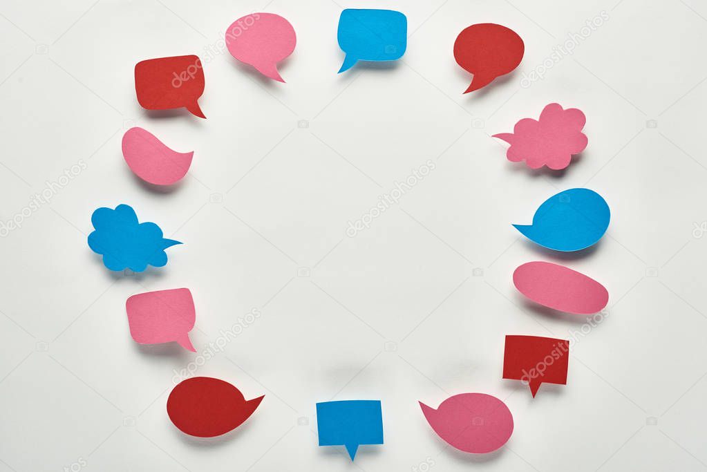round frame of empty colorful speech bubbles on white background, cyberbullying concept