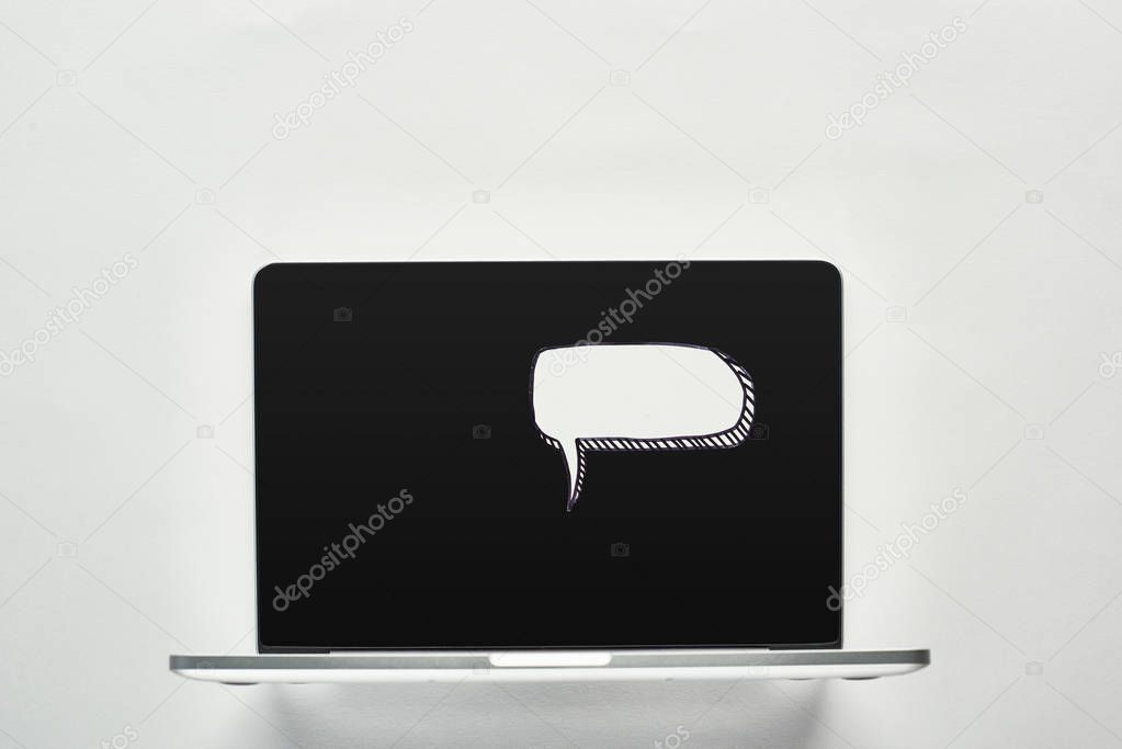 laptop with white blank speech bubble on white background, cyberbullying concept