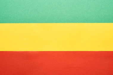 top view of colorful green, yellow and red Rastafarian flag  clipart