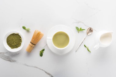 flat lay with green matcha tea on white table clipart
