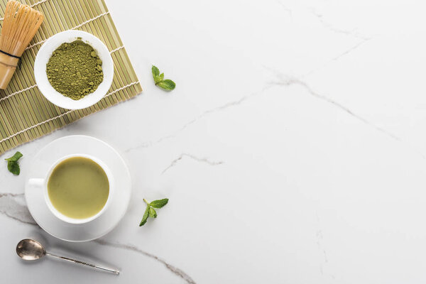 top view of green matcha tea on white table with copy space